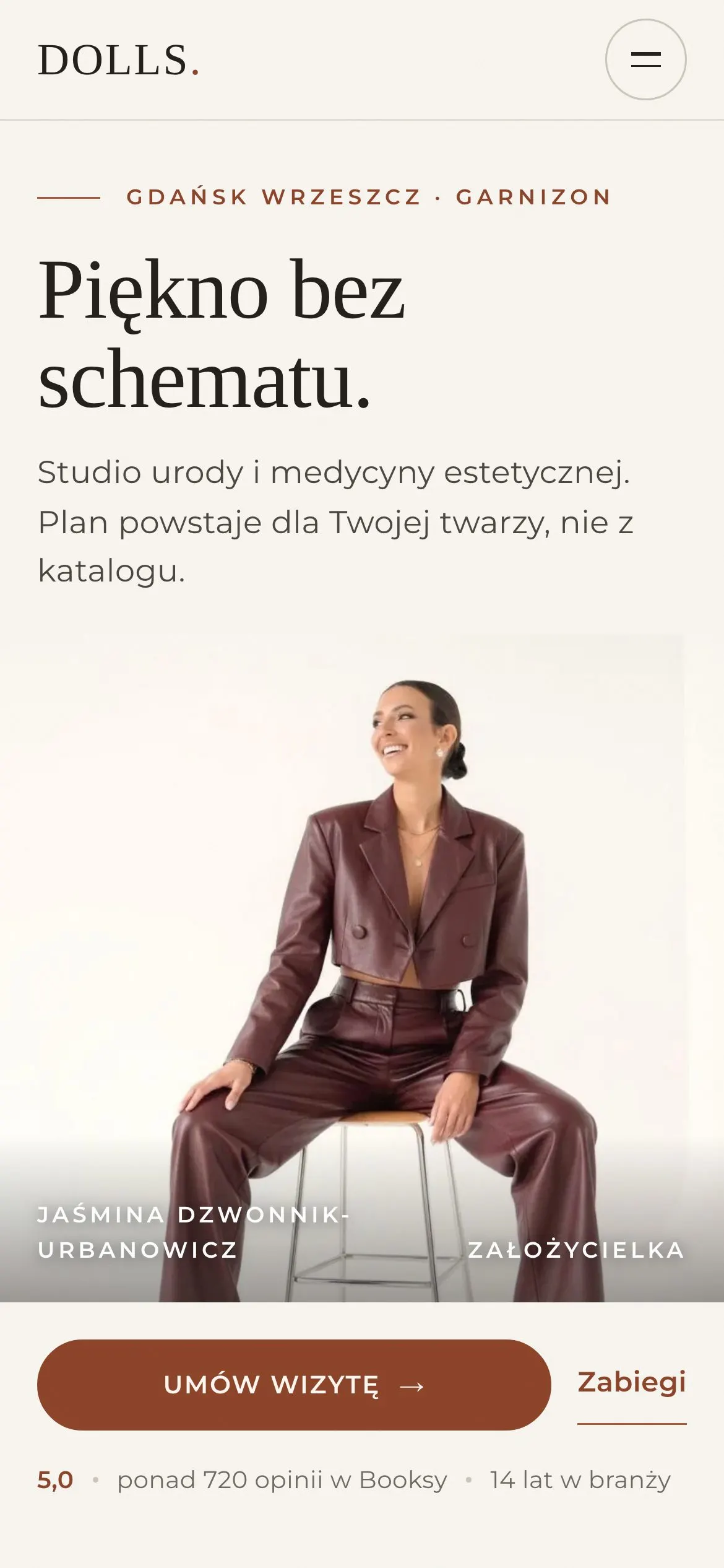 Strona DOLLS Studio na ekranie telefonu